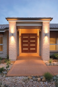 A new home with attractive outdoor lighting.
